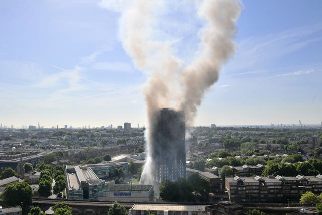 <p>Smoke billowing from the fire that engulfed the 24-storey Grenfell Tower in west London</p>