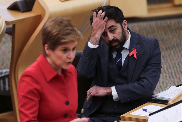 <p>Scotland’s health secretary Humza Yousaf looks on as Scotland’s first minister Nicola Sturgeon speaks in Holyrood</p>