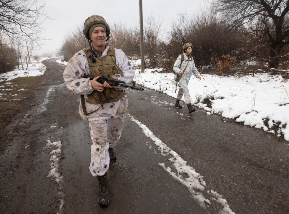 Ukrainian soldiers walks at the line of separation from pro-Russian rebels near Katerinivka, Donetsk region, Ukraine (Andriy Dubchak/AP)