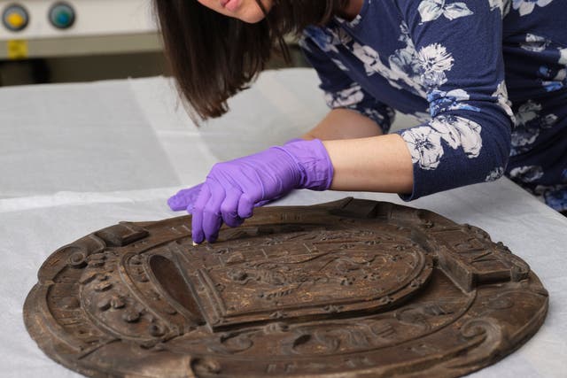 Conservators are working on the panels (National Museums Scotland/PA)