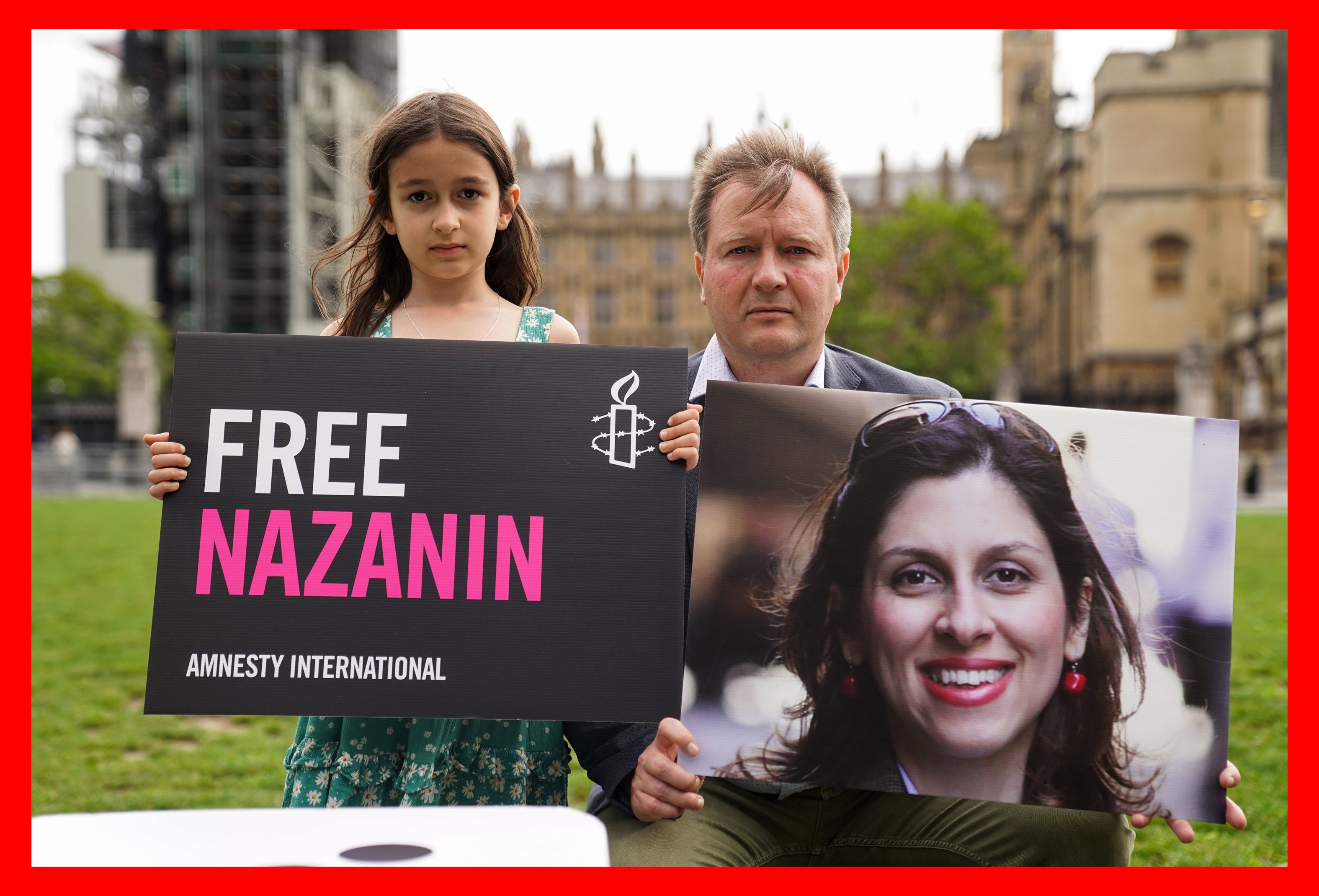 Richard Ratcliffe and his daughter, Gabriella, protest in Parliament Square, London about the continued detention of Nazanin Zaghari-Ratcliffe (Kirsty O’Connor/PA)