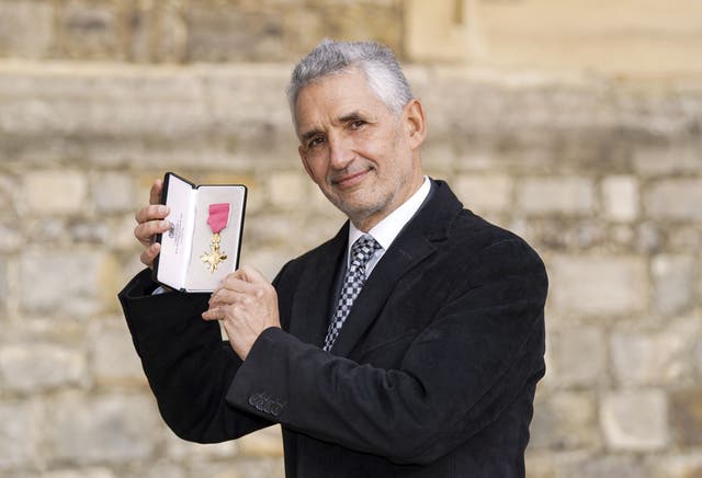 Professor Timothy Spector – Professor of Genetic Epidemiology at King’s College, London – with his award after he was made a OBE (Steve Parsons/PA)