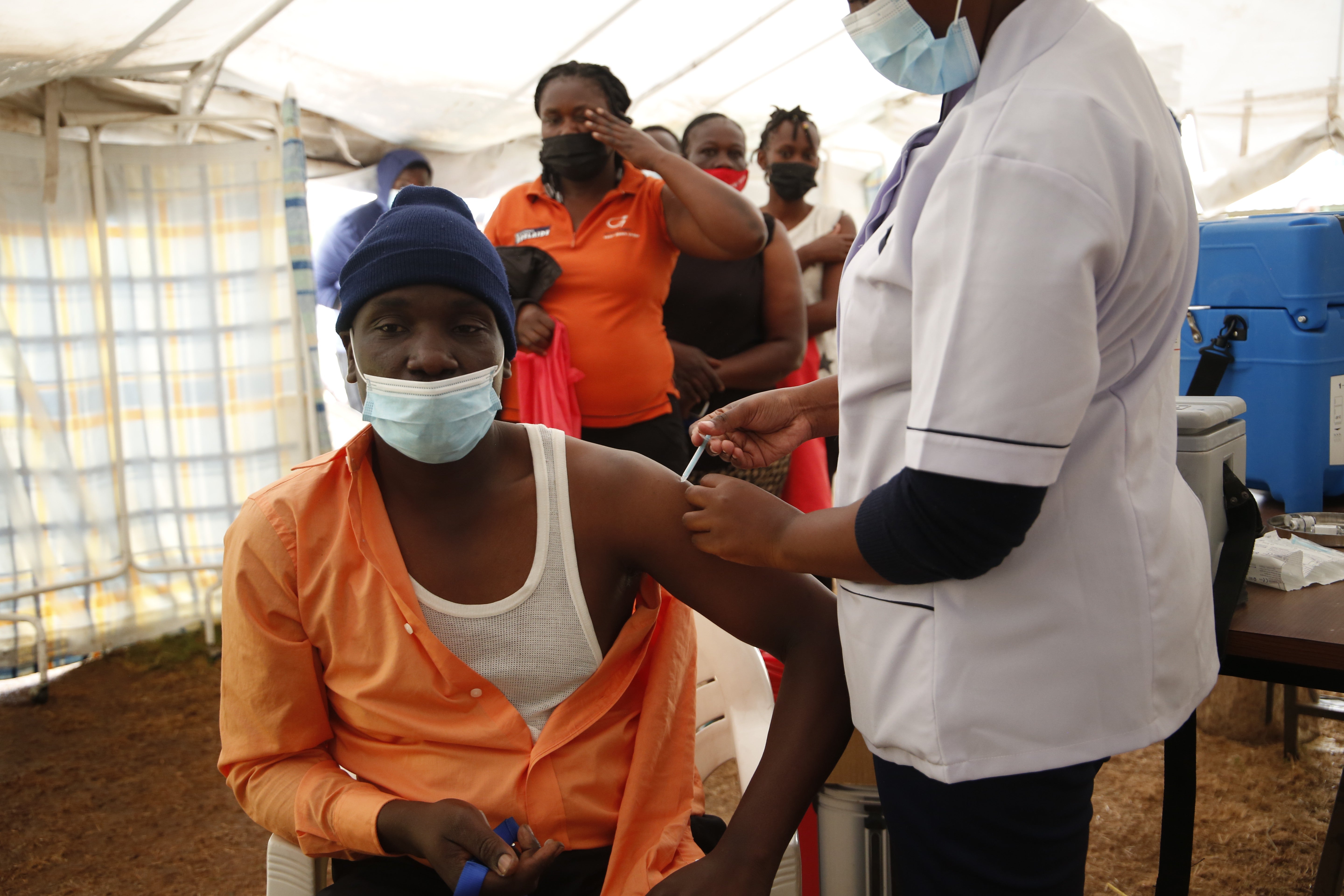 A man gets vaccinated at Kenyatta National Hospital in Nairobi, Kenya
