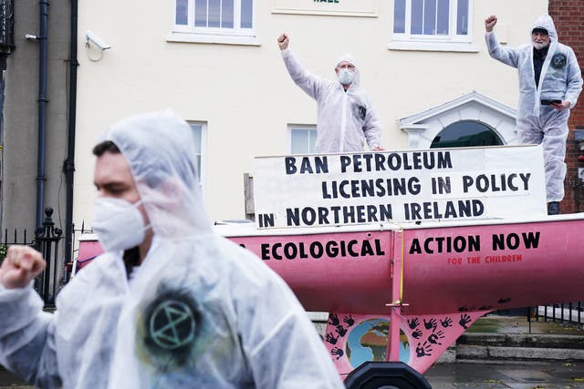 Extinction Rebellion activists held a demonstration outside Sinn Fein’s headquarters in Dublin calling for action in the Northern Ireland Executive over oil and gas exploration and extraction (Brian Lawless/PA)