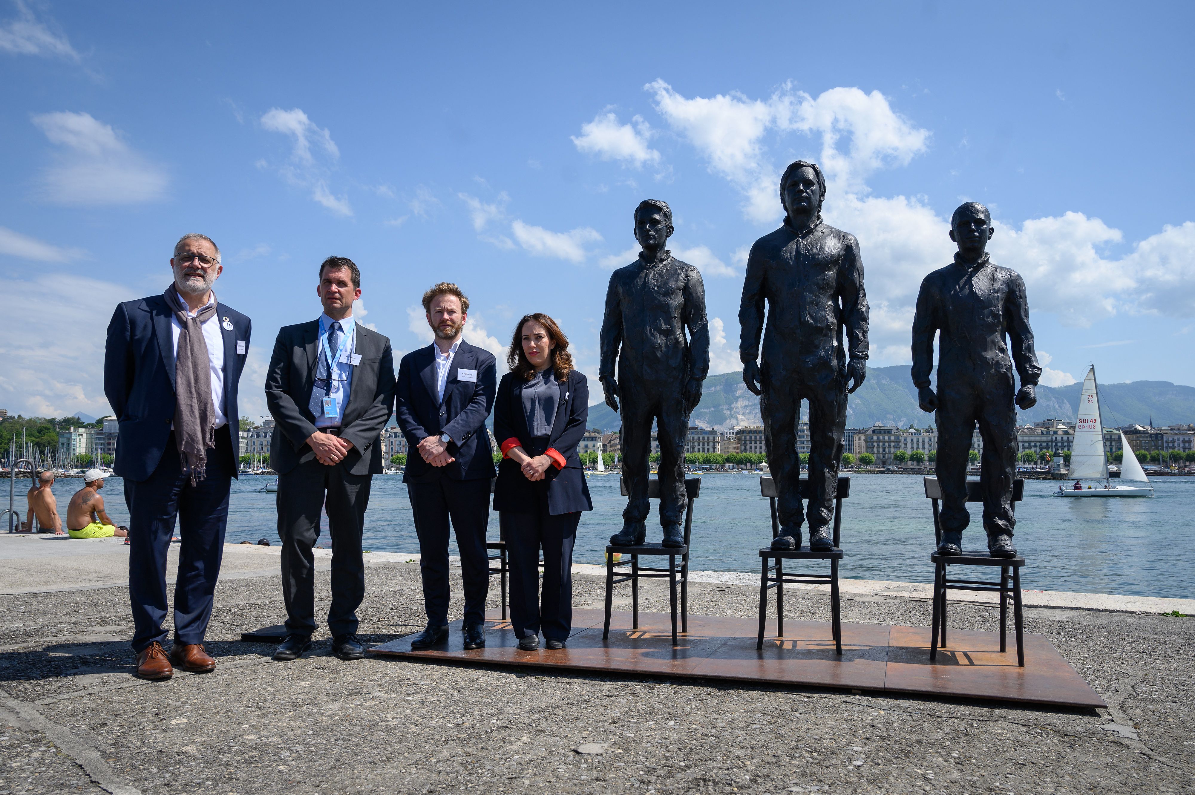 The Geneva Appeal: (from left) Swiss MP Carlo Sommaruga, Nils Melzer, Antoine Vey and Stella Moris stand beside statues representing Edward Snowden, Julian Assange and Chelsea Manning