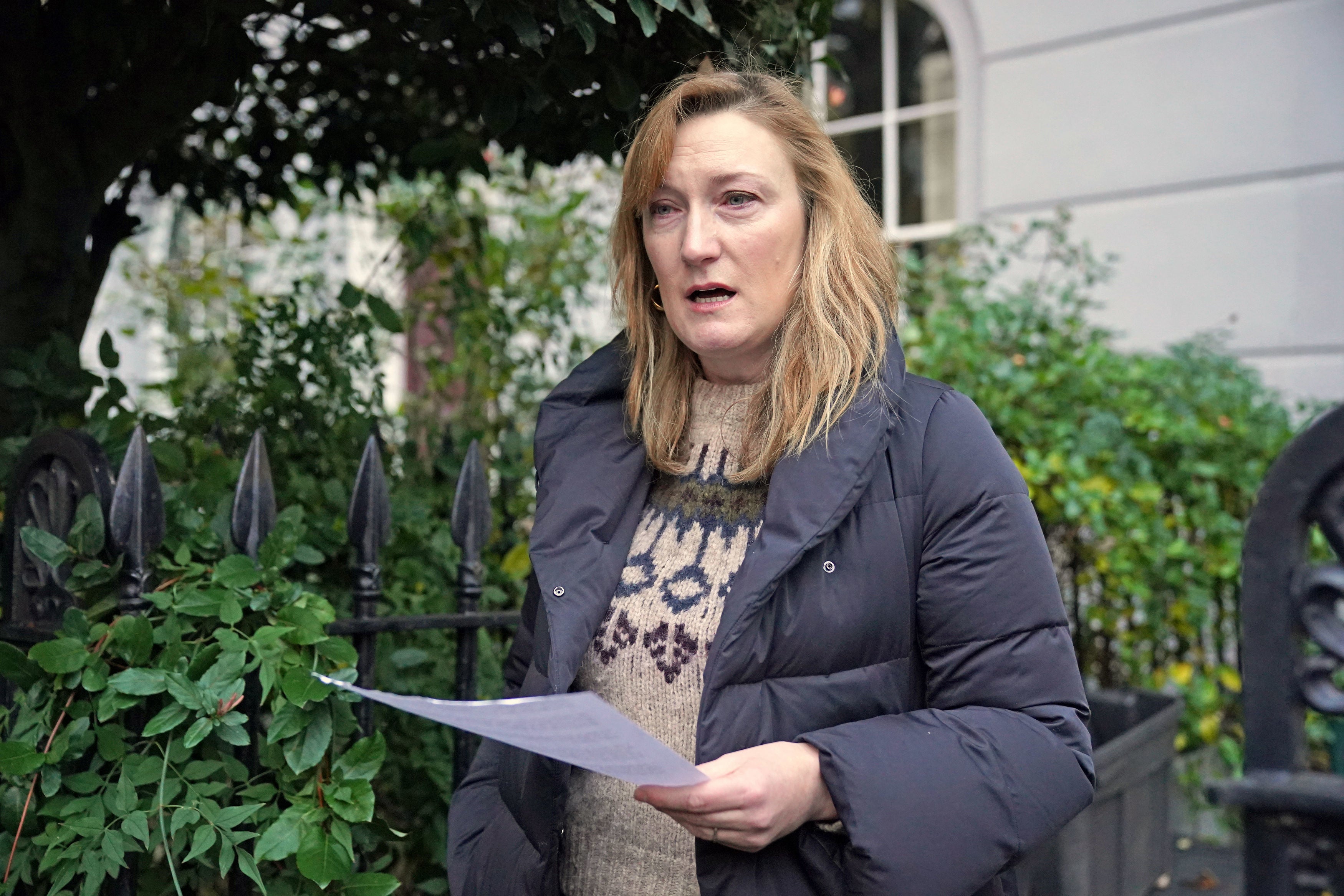 Allegra Stratton reads a statement to the media outside her home on Wednesday
