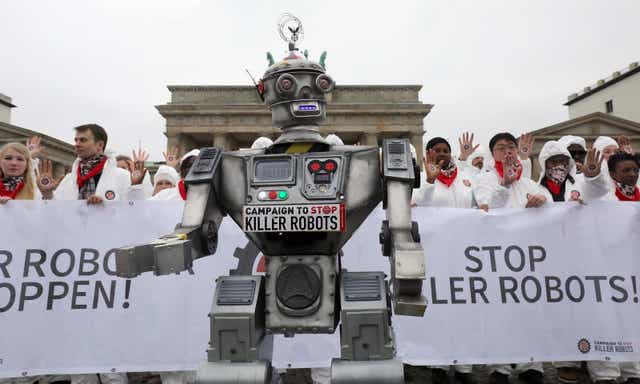 <p>People take part in a demonstration as part of the campaign “Stop Killer Robots” organised by German NGO “Facing Finance” to ban what they call killer robots on March 21, 2019 in front of the Brandenburg Gate in Berlin</p>