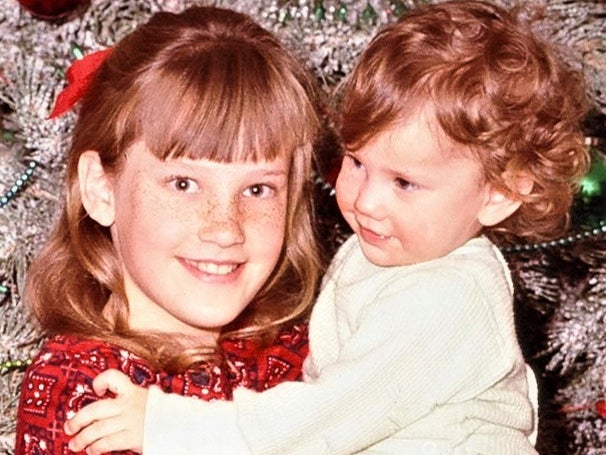 A young Brenda Wright holding her younger sister Sharon