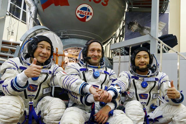 <p>Russian cosmonaut Alexander Misurkin (C) and space flight participants Japanese billionaire Yusaku Maezawa (L) and his assistant Yozo Hirano attend a training ahead of the expedition to the ISS </p>