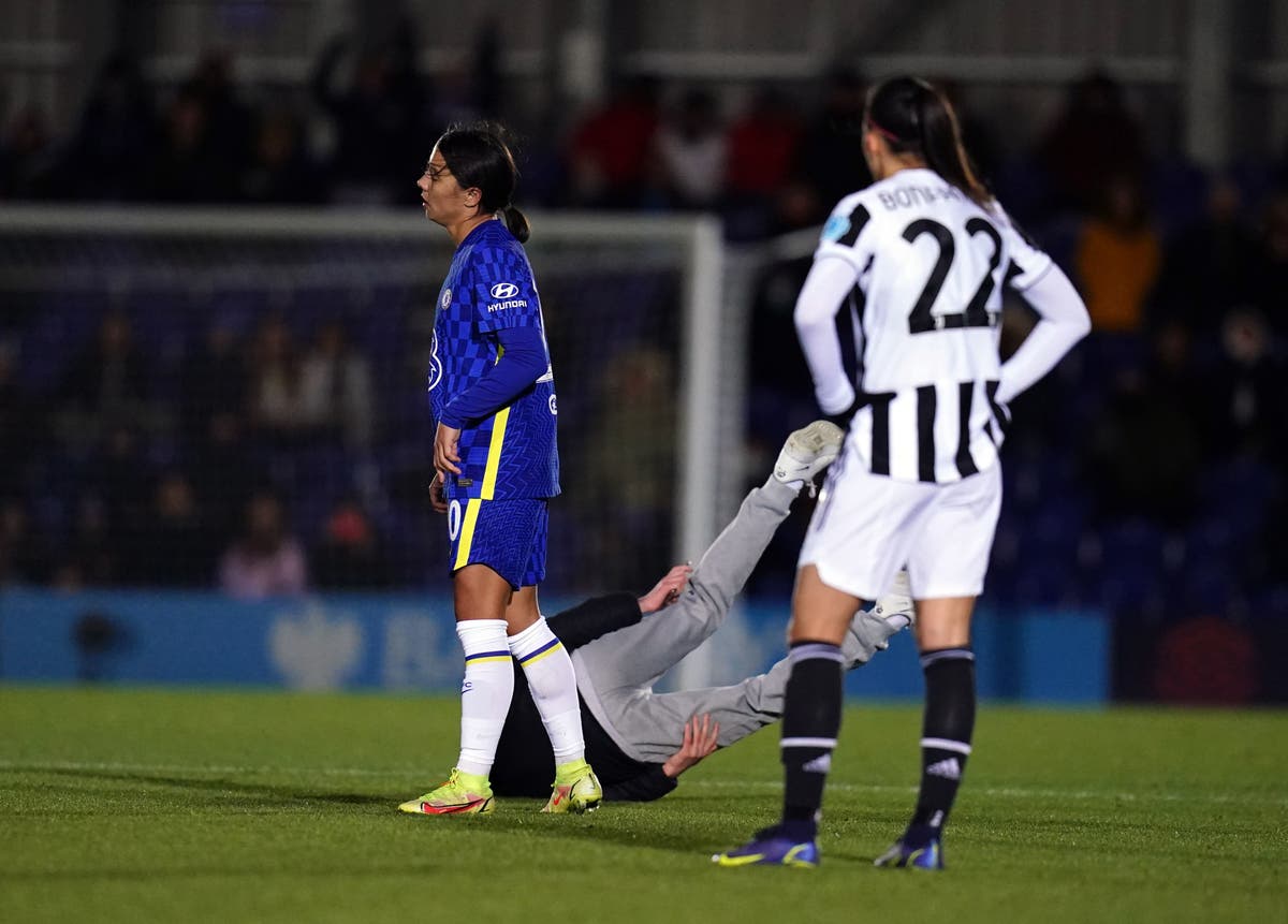 Chelsea striker Sam Kerr booked after barging pitch invader to the ground