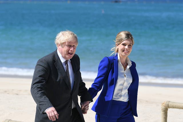 <p>Boris Johnson and Carrie (L) at the G7 Summit</p>