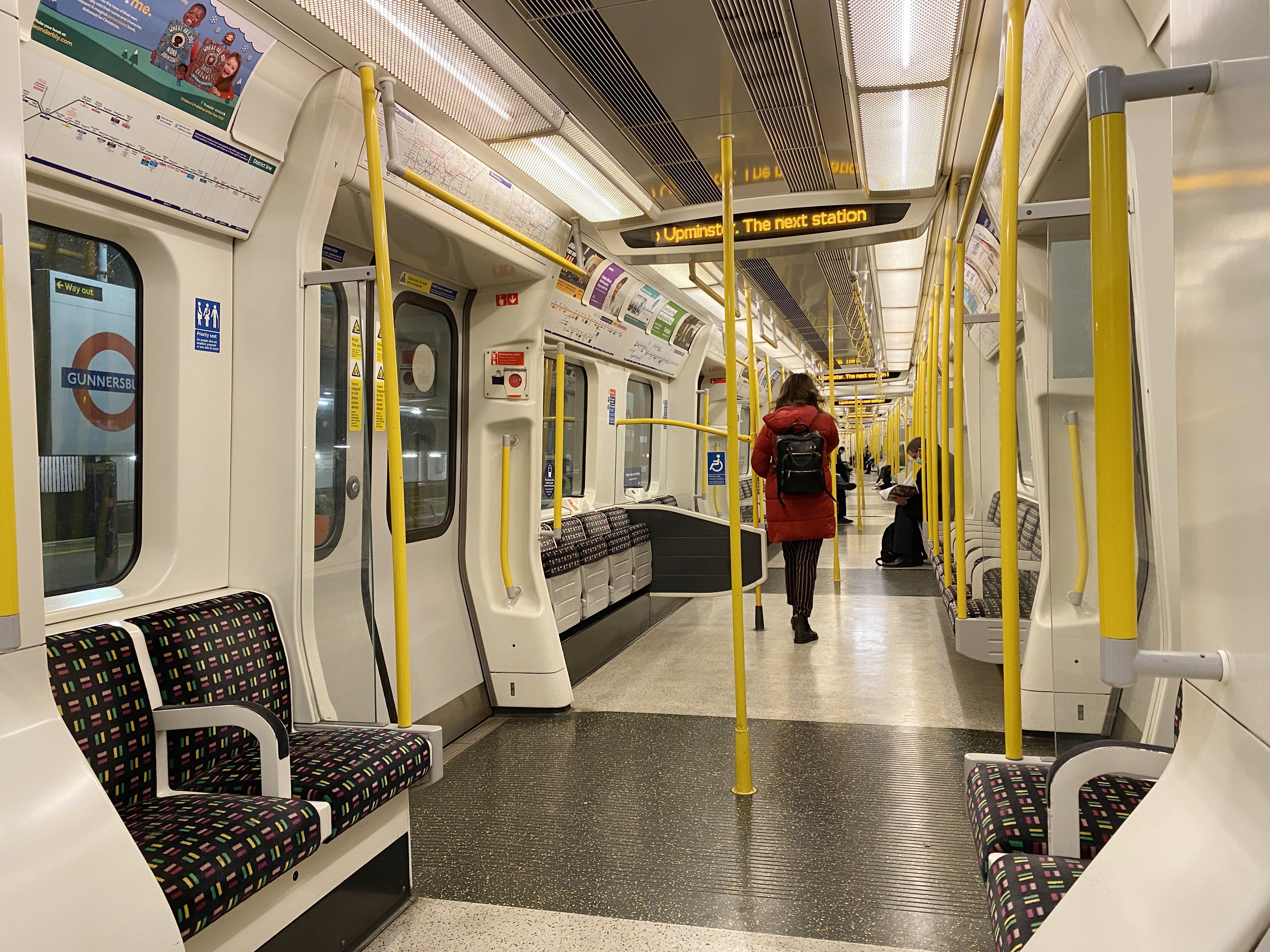 Empty seats on an early-morning commuter train on the District line in west London the morning after Prime Minister Boris Johnson announced Plan B (Martin Keene/PA)
