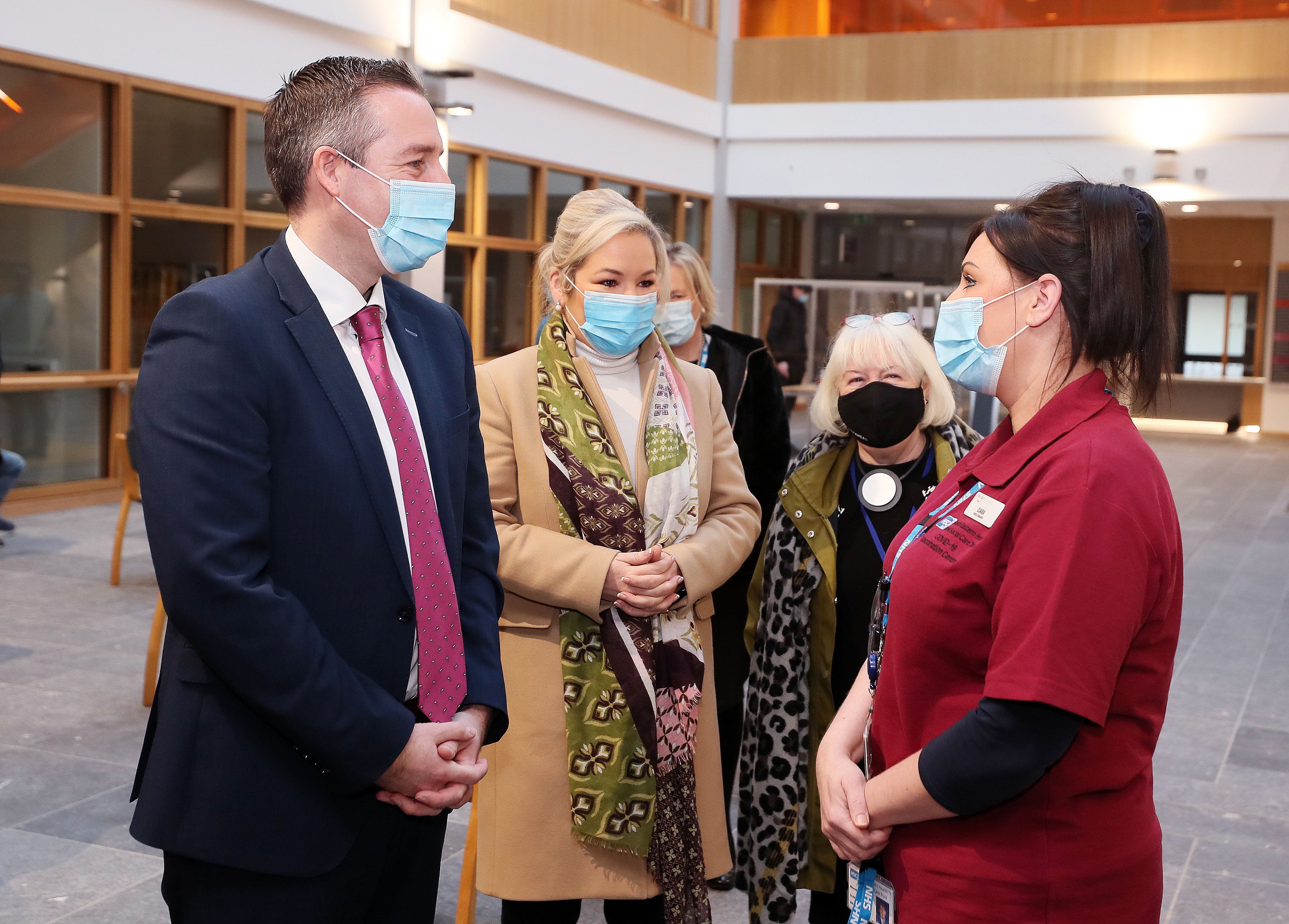 First Minister Paul Givan, Deputy First Minister Michelle O’Neill and head of the vaccination programme Patricia Donnelly (right) at Lisburn Primary and Community Care Centre (Jonathan Porter/Press Eye/PA)