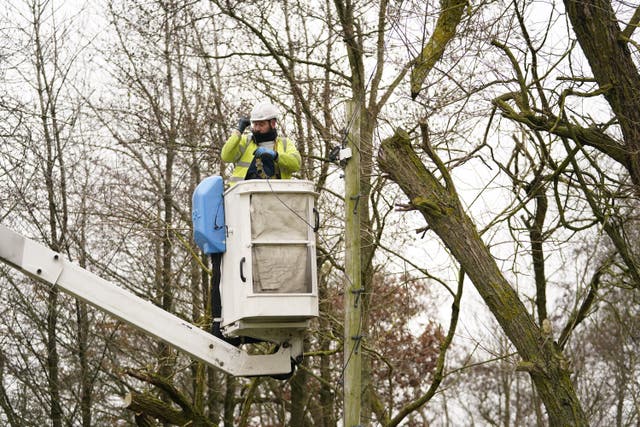An Openreach engineer fixes telephone lines near Barnard Castle in County Durham in the aftermath of Storm Arwen (Danny Lawson/PA)