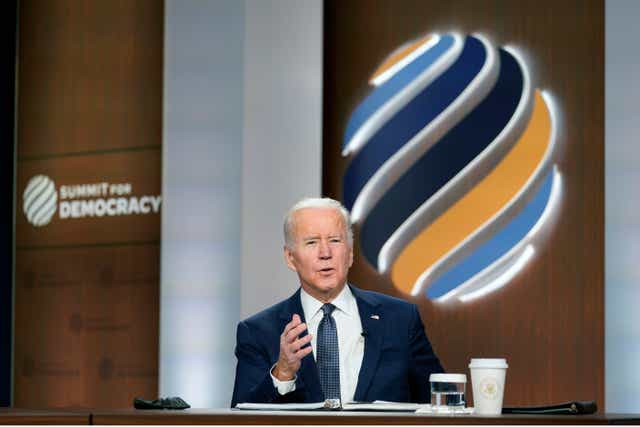 <p>President Joe Biden speaks from the South Court Auditorium on the White House complex in Washington, Thursday, Dec. 9, 2021, for the opening of the Democracy Summit. The two-day virtual summit is billed as an opportunity for leaders and civil society experts from some 110 countries to collaborate on fighting corruption and promoting respect for human rights. (AP Photo/Susan Walsh)</p>