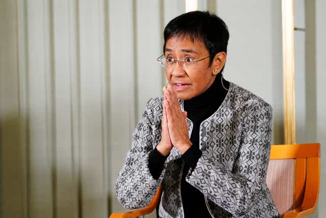 <p>File Filipino journalist Maria Ressa sits with fellow peace Prize winner Russian journalist Dmitry Muratov,  during a press conference, at the Nobel Institute, a day prior to the award ceremony, in Oslo</p>