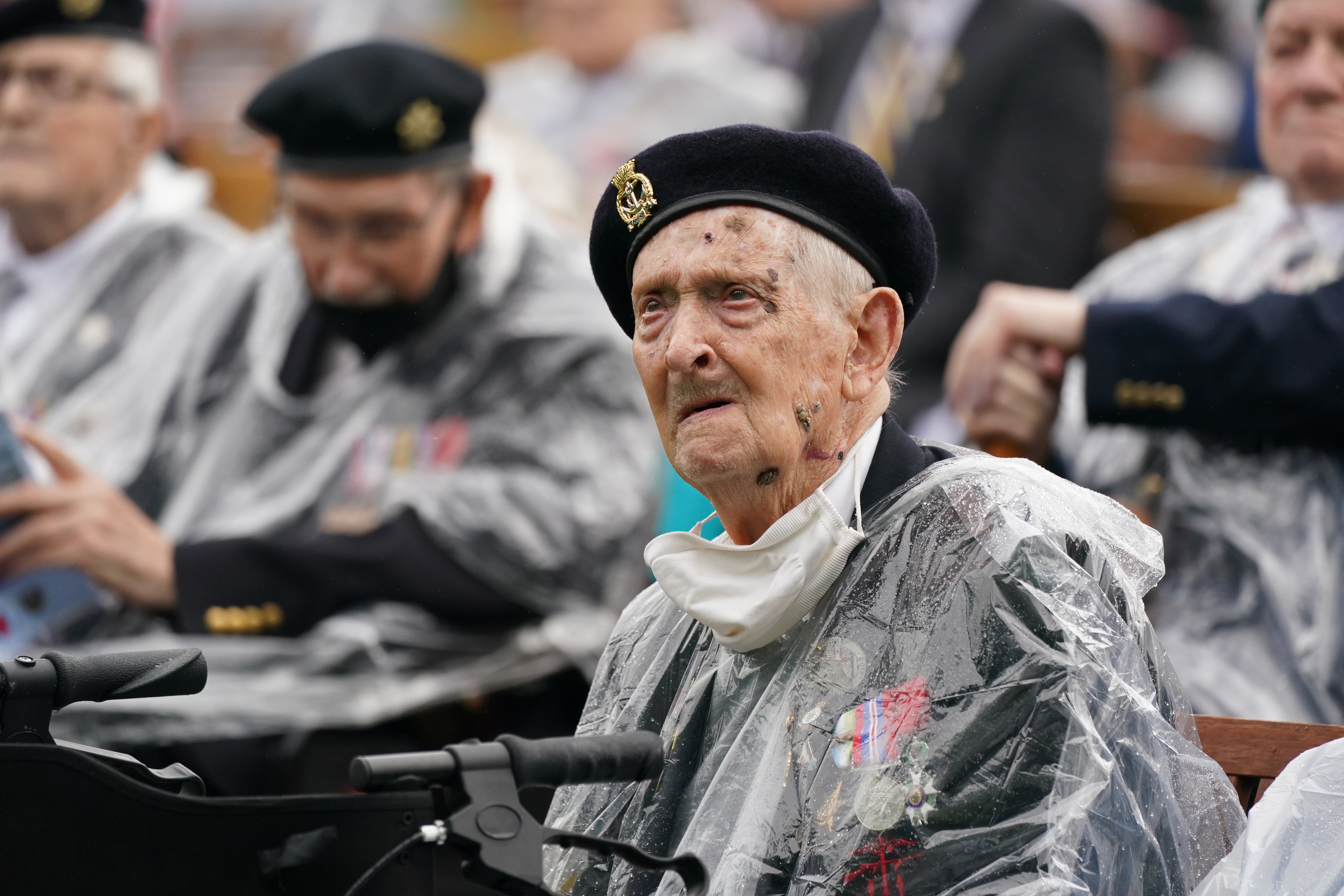 Veterans watch the official opening of the British Normandy Memorial in France (Jakob King/PA)