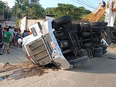 At least 54 dead as freight truck packed with migrants crashes in Mexico 