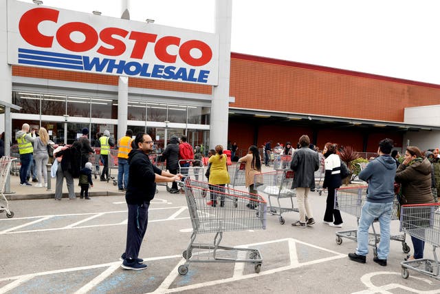 <p>File: Customers seen outside a Costco store </p>