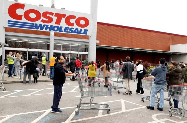 <p>File: Customers seen outside a Costco store </p>