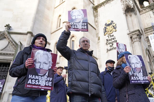 Supporters of Julian Assange demonstrate outside the Royal Courts of Justice in London, where Mr Assange is due to find out whether senior judges will overturn a decision not to extradite him to the US when the High Court gives its ruling on his case on Friday. Picture date: Friday December 10, 2021.
