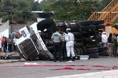 At least 54 dead as freight truck packed with migrants crashes in Mexico 