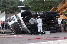 At least 54 dead as freight truck packed with migrants crashes in Mexico