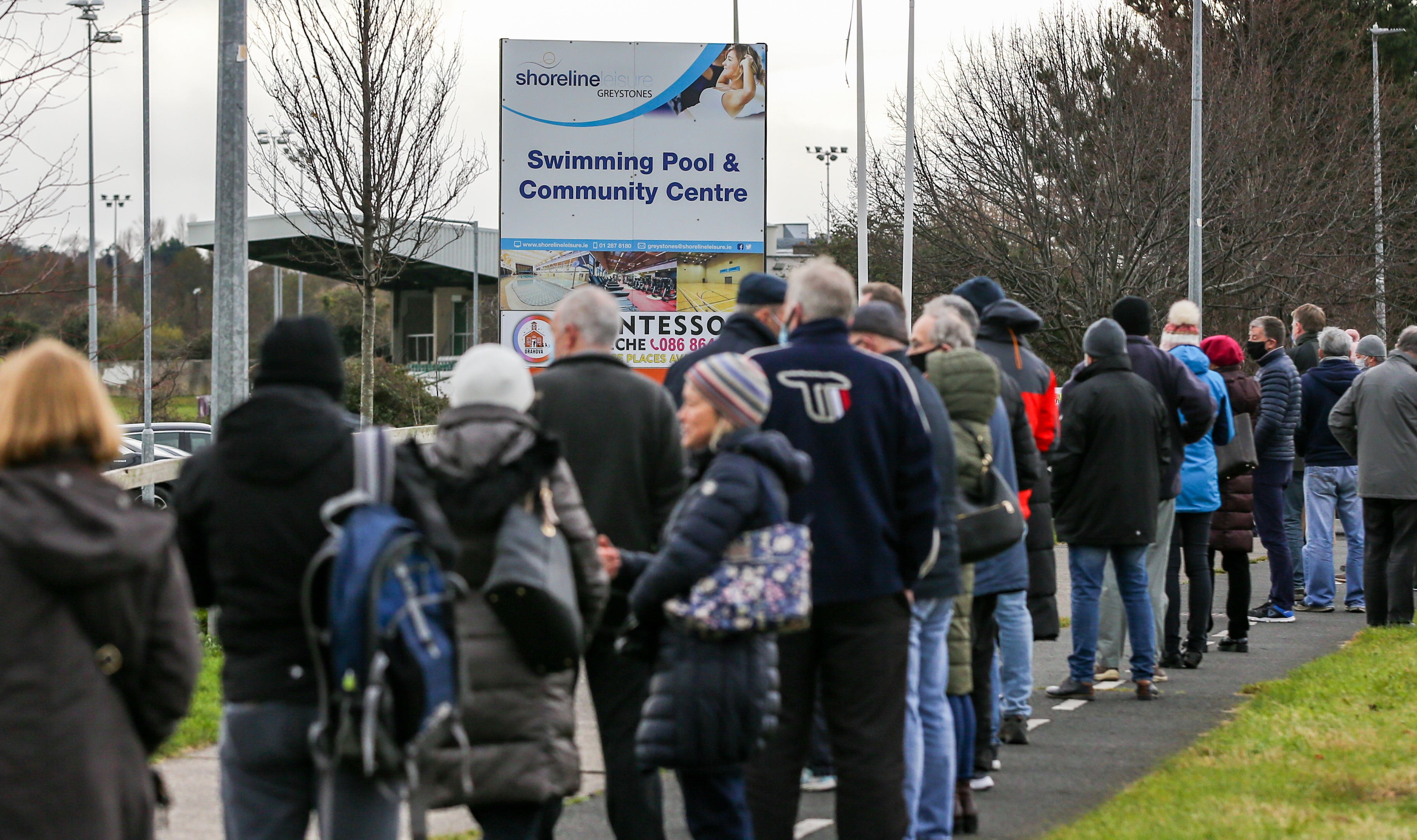 Queues of people form outside a walk-in vaccination centre in Greystones, Co Wicklow (Damien Storan/PA)