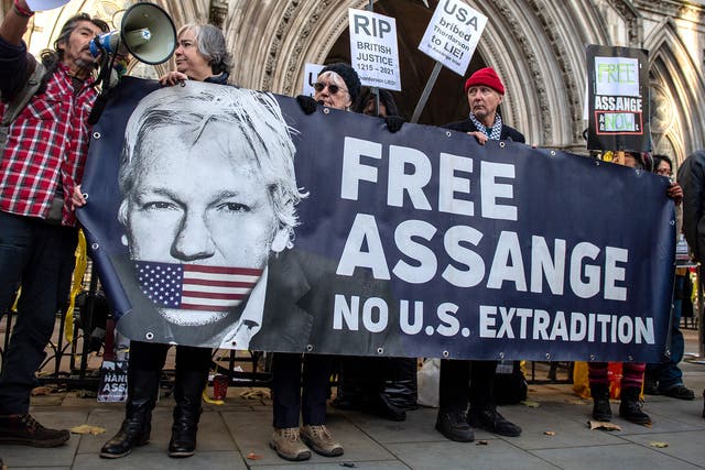 <p>Supporters of Julian Assange outside the High Court last week</p>