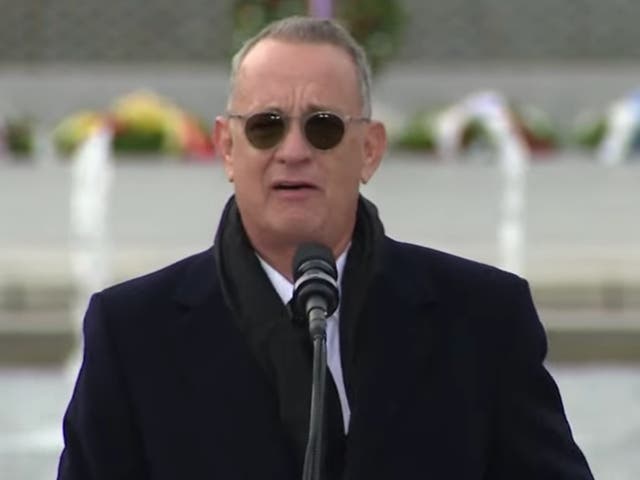 <p>Tom Hanks pays tribute to the late Senator Bob Dole at the World War II Memorial in Washington, DC on 10 December 2021</p>