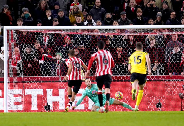 Bryan Mbeumo, left, scores Brentford’s winner from a late penalty (John Walton/PA)