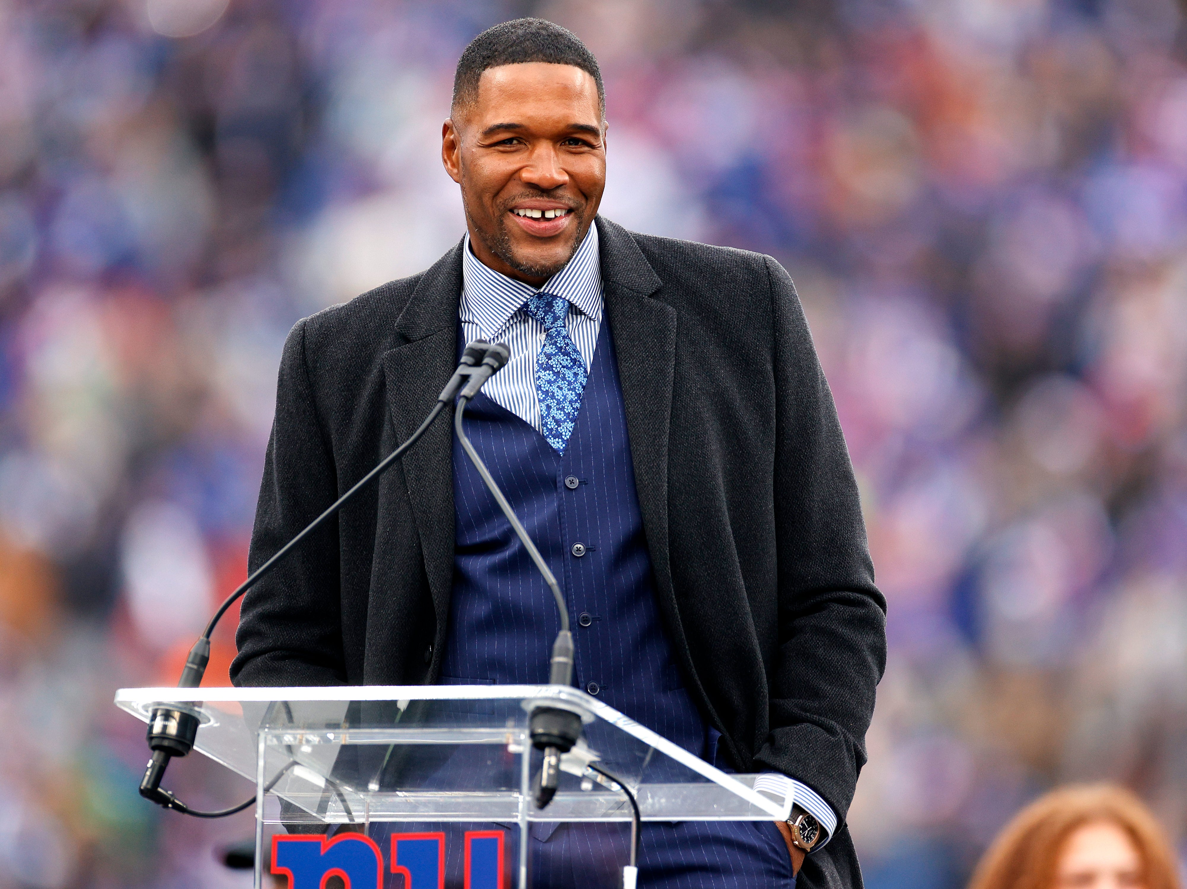 Michael Strahan speaks during the ceremony to retire his number at half time of the game between the Philadelphia Eagles and the New York Giants at MetLife Stadium on 28 November 2021 in East Rutherford, New Jersey