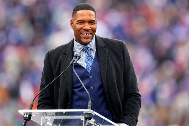 <p>Michael Strahan  speaks during the ceremony to retire his number at half time of the game between the Philadelphia Eagles and the New York Giants at MetLife Stadium on 28 November 2021 in East Rutherford, New Jersey</p>
