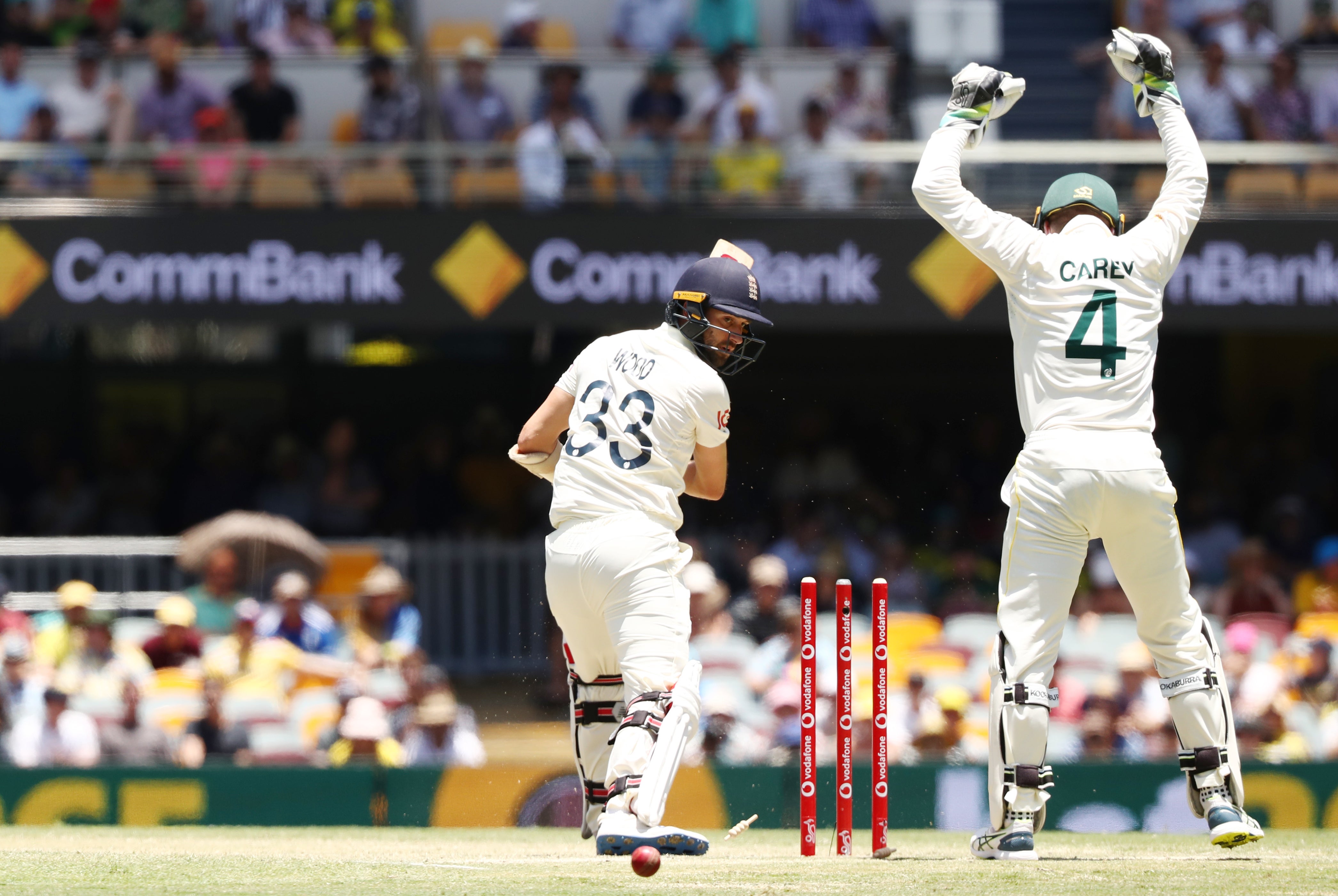 England’s Mark Wood is bowled by Nathan Lyon during day four of the first Ashes test at The Gabba, Brisbane (Jason O’Brien/PA)