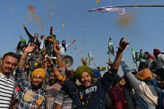 ‘Tractors as far as the eye can see’: Indian farmers pour out of Delhi as marathon protests finally end