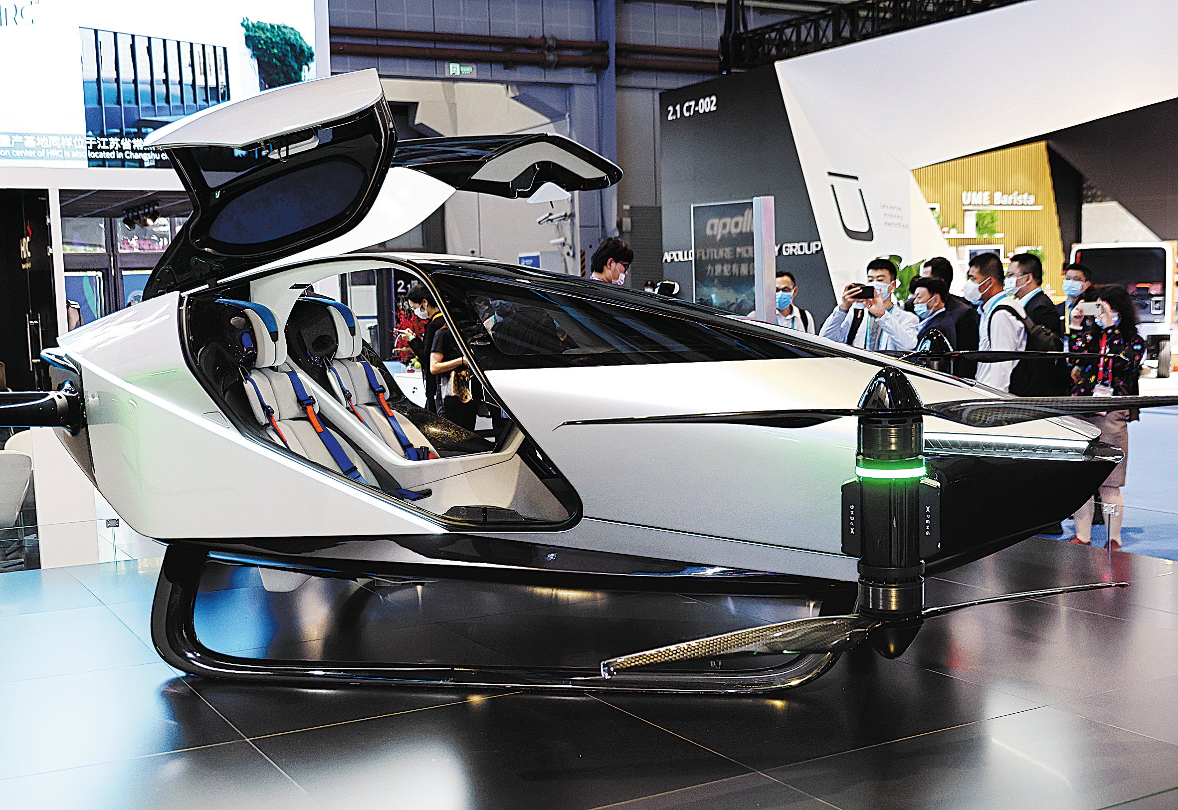 Visitors look over the X2 flying car, produced by Chinese company XPeng, that is on display at the China International Import Expo held in Shanghai in November