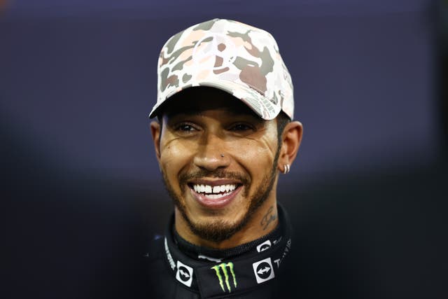 <p>Lewis Hamilton looks on in parc ferme at the Grand Prix of Abu Dhabi at Yas Marina Circuit</p>