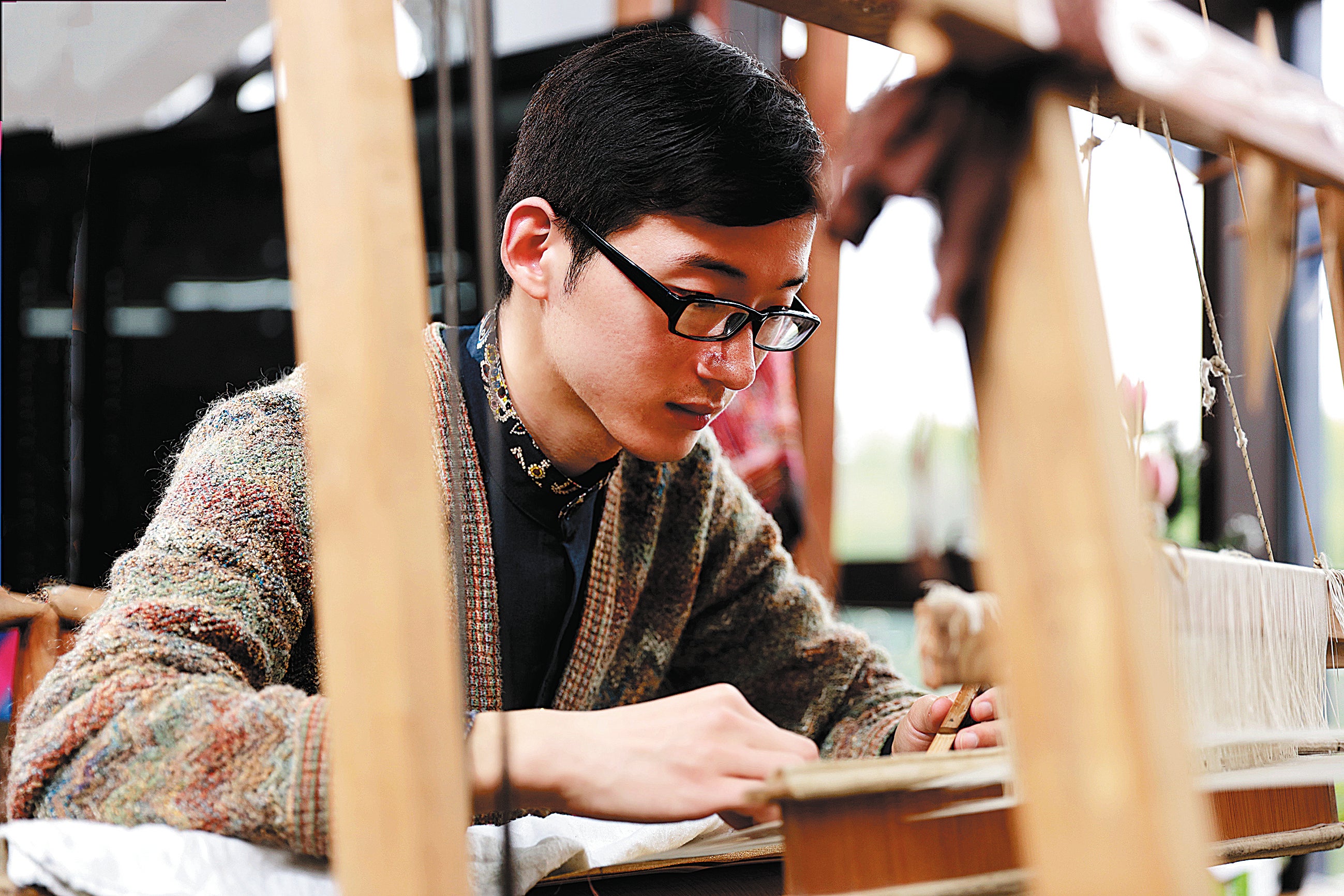 Artist Hao Naiqiang works on a silk craft called kesi, a UNESCO Intangible Cultural Heritage, at his studio in Suzhou, Jiangsu province