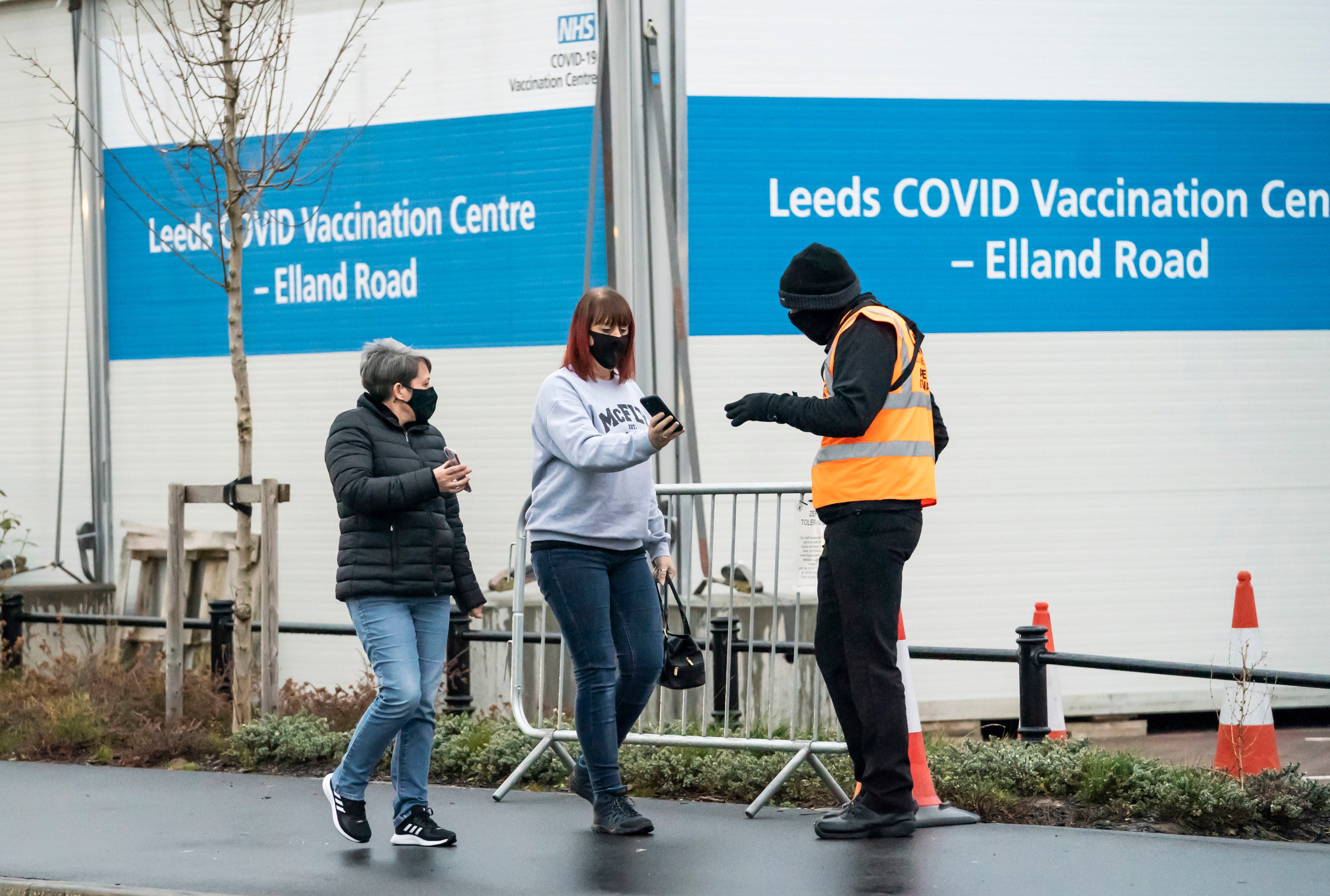 <p>People arrive at a Covid-19 vaccination centre at Elland Road in Leeds in Saturday</p>