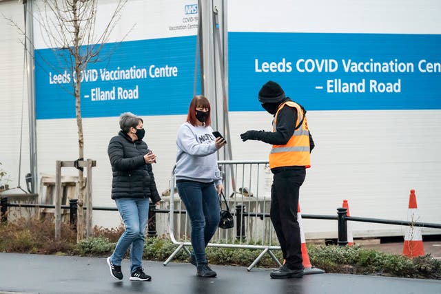 <p>People arrive at a Covid-19 vaccination centre at Elland Road in Leeds in Saturday</p>