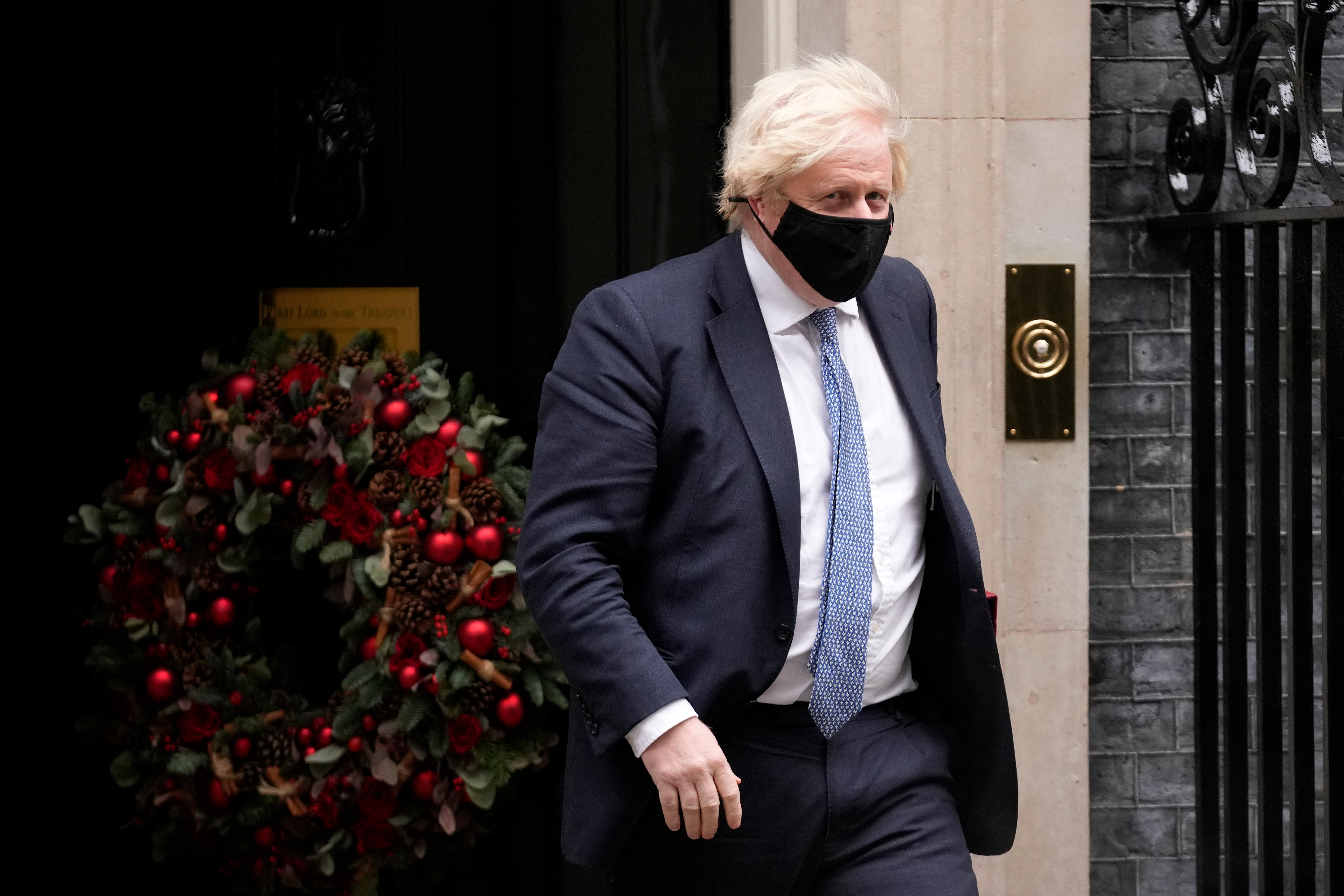 <p>British Prime Minister Boris Johnson leaves 10 Downing Street to attend the weekly Prime Minister’s Questions at the Houses of Parliament, in London, Wednesday, 8 December, 2021.</p>