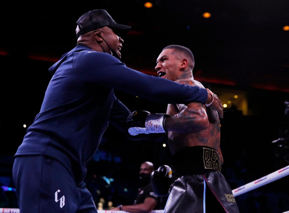 <p>Conor Benn (right) is embraced by father and boxing icon Nigel Benn </p>