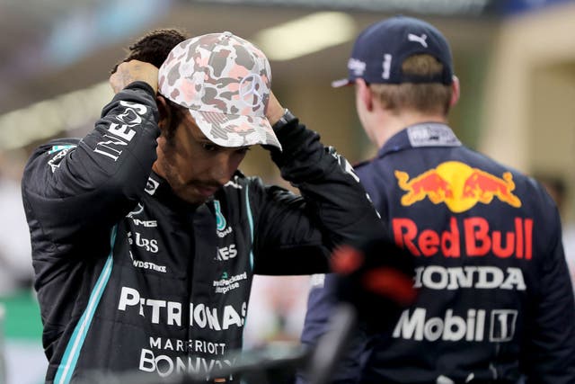 <p>Red Bull’s Helmut Marko has told Lewis Hamilton (left) that he must accept partial responsibility for Michael Masi’s removal </p>
