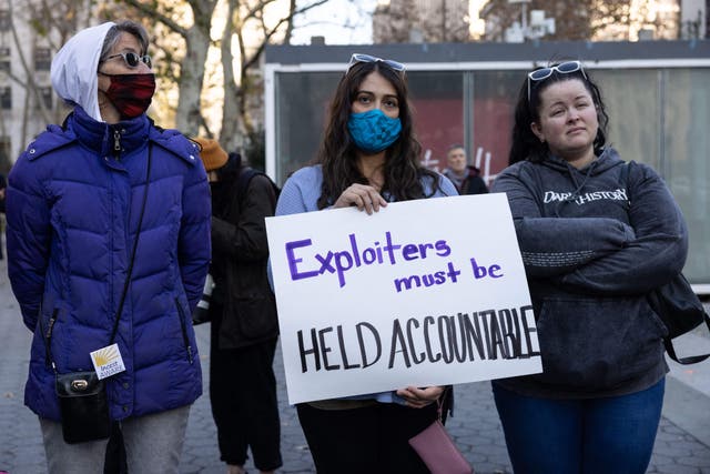 <p>Demonstrators rally in solidarity with the accusers outside Ghislaine Maxwell’s trial in New York on 4 December 2021</p>