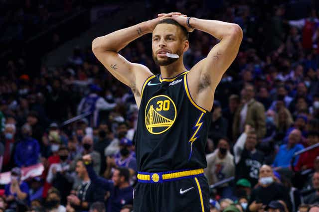 Golden State Warriors’ Stephen Curry puts his hands on his head during the second half of an NBA basketball game against the Philadelphia 76ers (AP Photo/Chris Szagola)