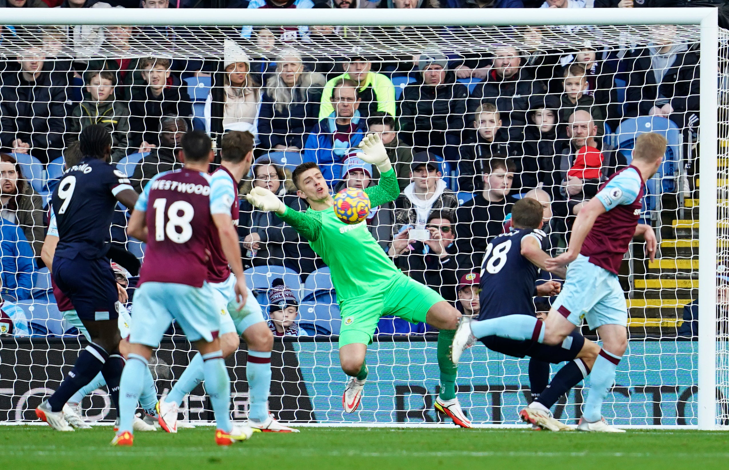 Burnley's goalkeeper Nick Pope makes a save in front of West Ham's Tomas Soucek