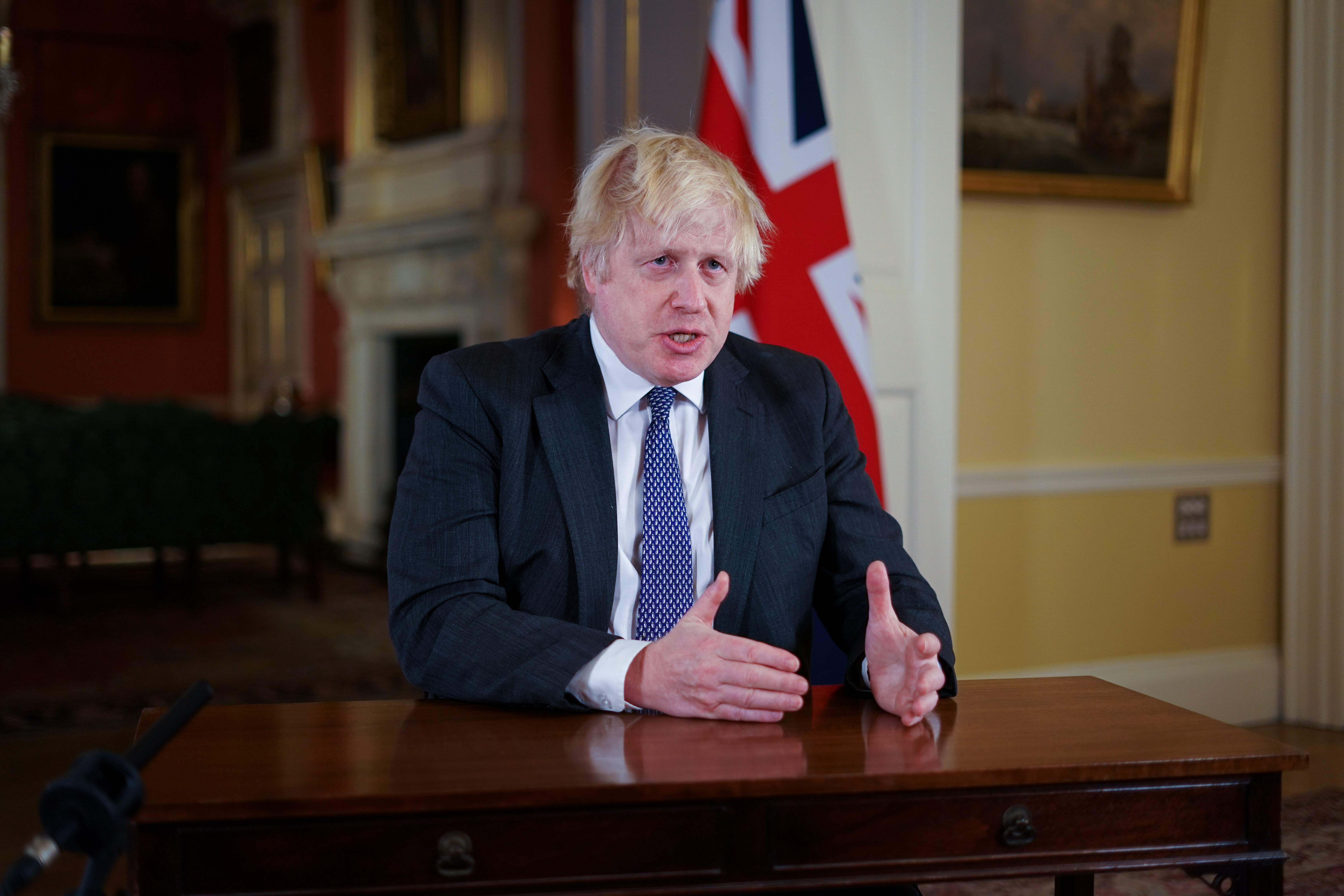 Mr Johnson said the target to give a booster vaccination to all eligible adults in England would be brought forward to the end of the year (Kirsty O’Connor/PA).