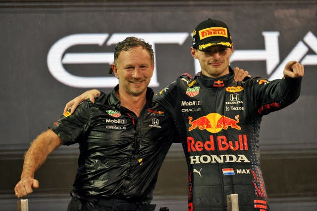 Christian Horner, left, and Max Verstappen celebrate (PA Wire)