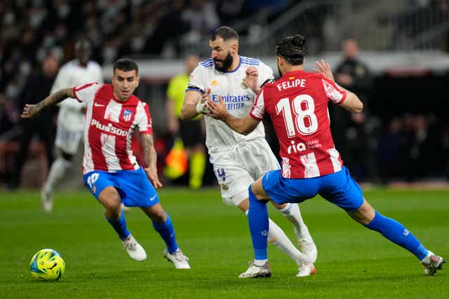 Karim Benzema helped Real Madrid beat city rivals Atletico (Bernat Armangue/AP)