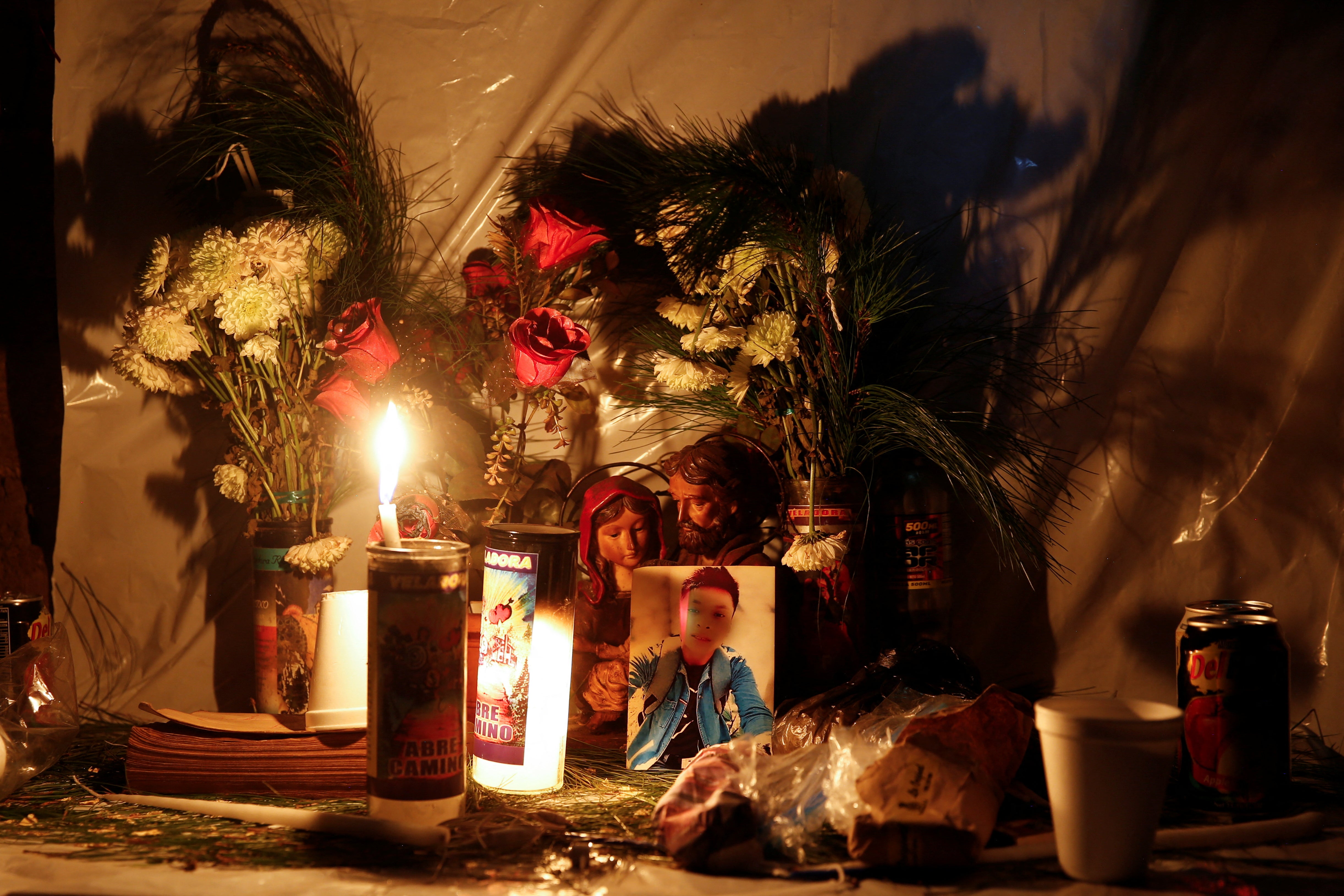 An altar in memory of Domingo Raymundo Mateo who died in the crash in Mexico is pictured in Chajul, Guatemala